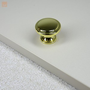 Gałka do mebli FINO okrągła płaska z frezem  fi 30 mm złoty połysk